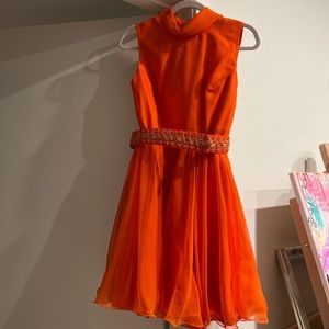 Absolutely stunning orange 1960s dress with detailed belt.